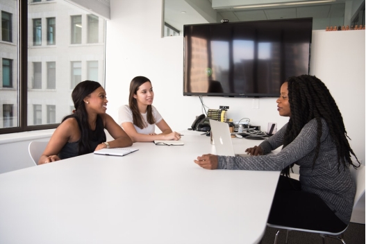 Three people having a discussion