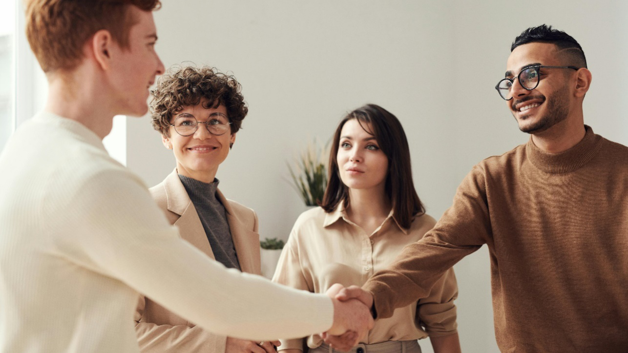 A group of people having a cordial conversation