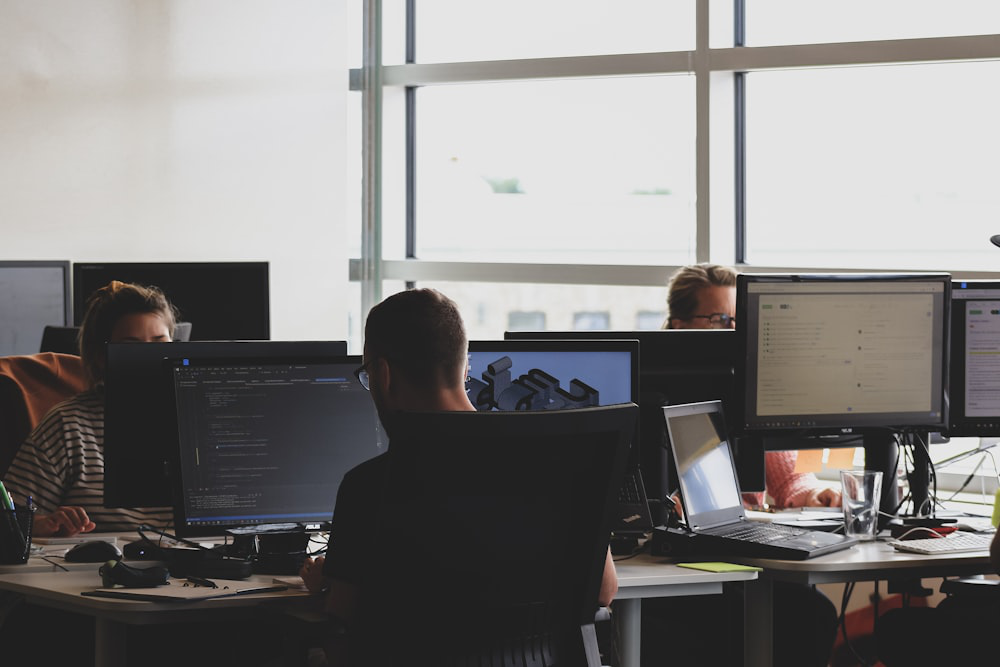 An image of people working on computers in the office   