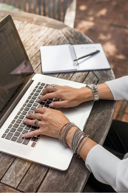 A photo of a person working on a laptop