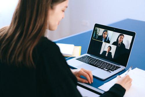 A female candidate giving an online interview to three females