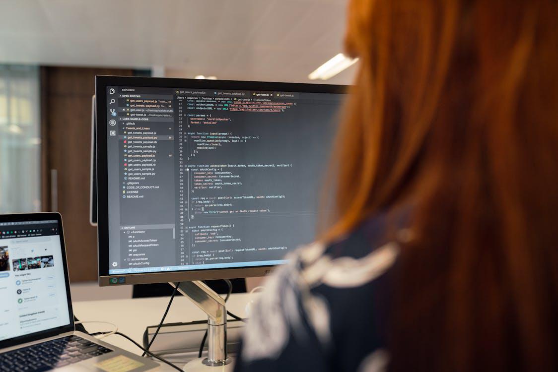 A female QA tester testing a software 