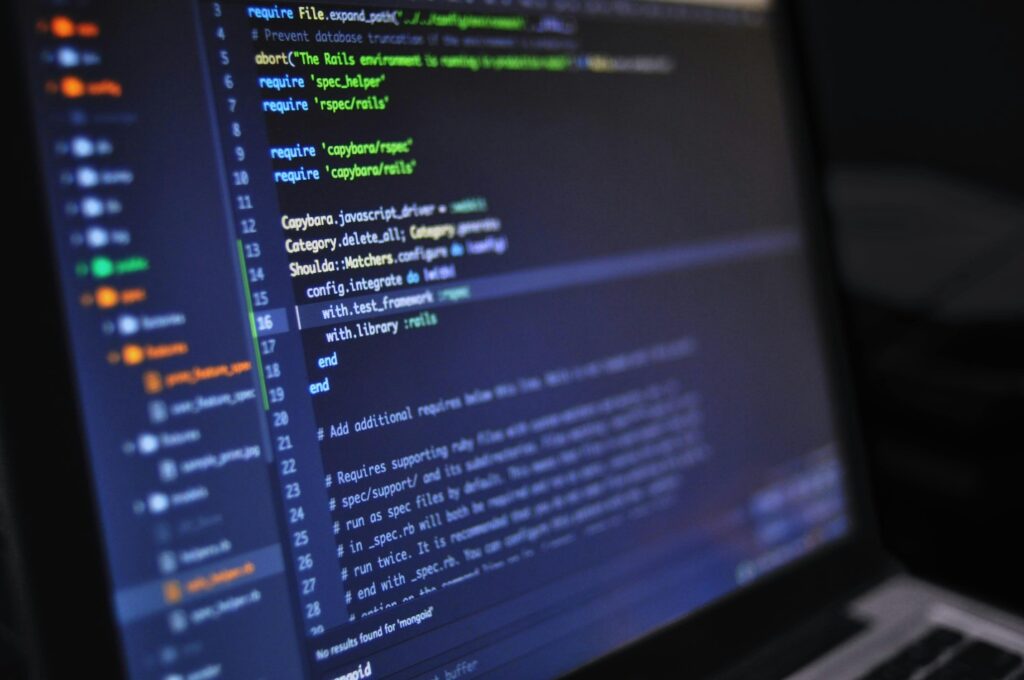 Person doing coding on a laptop