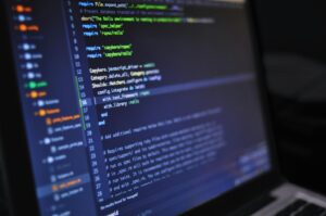 Person doing coding on a laptop